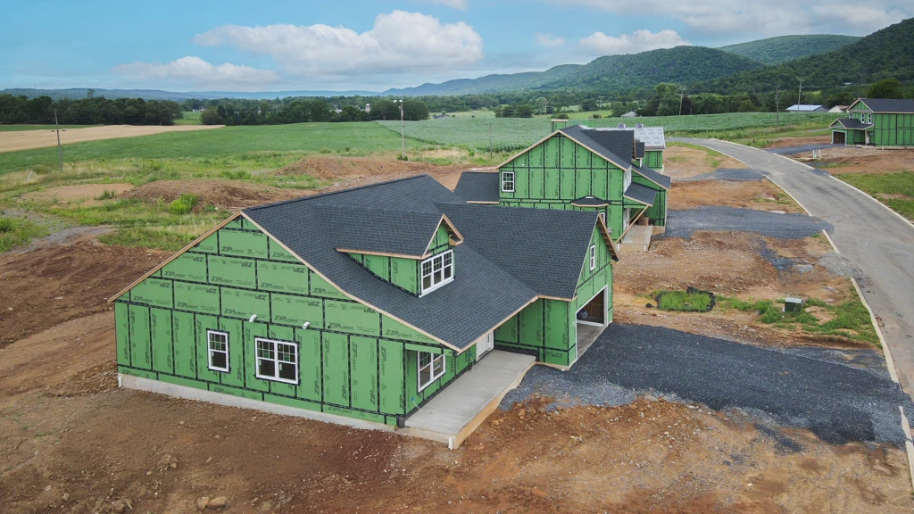 Laptop placed on a desk in a sun light lit room ready for online shopping.